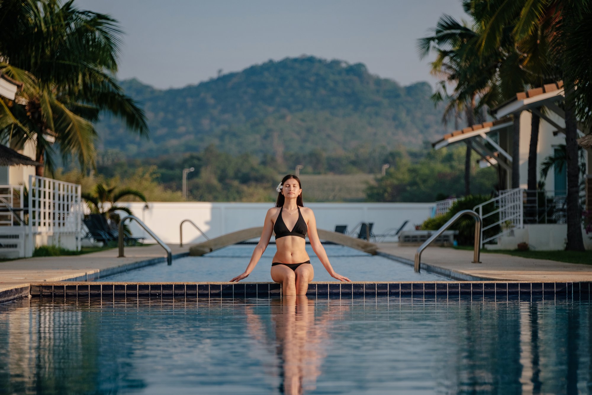 Woman_In_Swimsuit_Relaxing_At_Poolside_original_2542637 Woman_In_Swimsuit_Relaxing_At_Poolside_original_2542637